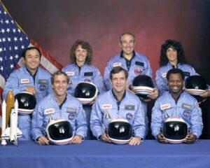 Challenger-crew2 NASA Photo: Back row (L to R): Mission Specialist, Ellison S. Onizuka, Teacher in Space Participant Sharon Christa McAuliffe, Payload Specialist, Greg Jarvis and Mission Specialist, Judy Resnik. Front row (L to R): Pilot Mike Smith, Commander, Dick Scobee and Mission Specialist, Ron McNair.