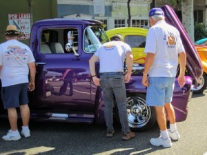 Photo: FLLewis/Media City G -- A couple of guys checked under the hood of a cool purple truck at"Be-Boppin' in the Park" in Burbank August 20, 2011