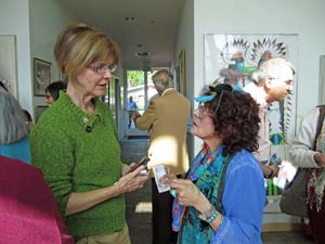 Photo: FLLewis/Media City G -- Burbank Councilwoman Emily Gabel-Luddy got into a deep discussion with artist Alice Asmar at a reception inside the Geo Gallery Glendale March 11, 2012