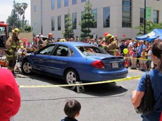 Photo: FLLewis/Media City G -- Firefighters demonstrate the technique for extricating victims trapped in vehicle accidents at Police and Fire Service Day in Downtown Burbank May 12, 2012