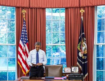 Photo: Pete Souza/White House -- President Barack Obama in the Oval Office August 1, 2013
