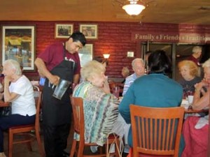 Photo: FLLewis/Media City G -- A member of the waitstaff poured water for a customer at the Tallyrand restaurant 1700 West Olive Avenue Burbank September 24, 2013
