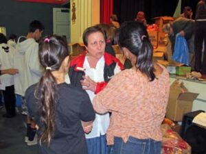 Photo: FLLewis/Media City G -- Organizer Janet Diel gave a pep talk to two volunteers at George Washington Elementary School in Burbank December 13, 2013
