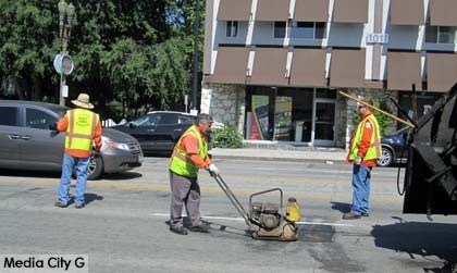 Photo: FLLewis/ Media City G -- Public Works crews made repairs on Olive Avenue today (April 24, 2014)in preparation for Burbank on Parade Saturday, April 26, 2014