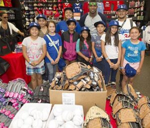Photo: Jon SooHoo/LA Dodgers -- Yasiel Puig with some of the young softball players he helped pick out equipment at the Sports Authority in Burbank June 14, 2014