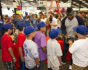 Photo: Jon SooHoo/LA Dodgers -- Yasiel Puig gave advice on selecting a baseball glove to a group of kids from Boyle Heights on a shopping spree at Sports Authority in Burbank June 14, 2014