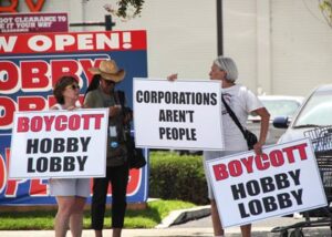 Photo: Greg Reyna Freelance Photog -- Protesters held up large signs slamming Hobby Lobby in Burbank July 12, 2014