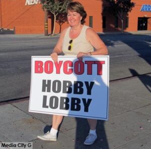 Photo: FLLewis/Media City G - Protest organizer Cheryl Holt on North Victory Boulevard in front of the Burbank Hobby Lobby July 9, 2014