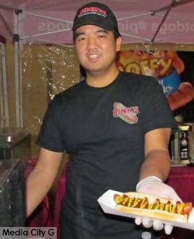 Photo: FLLewis / Media City G -- A Pink's staffer showed off one of its famous hot dogs at the Toluca Lake Open House December 5, 2014