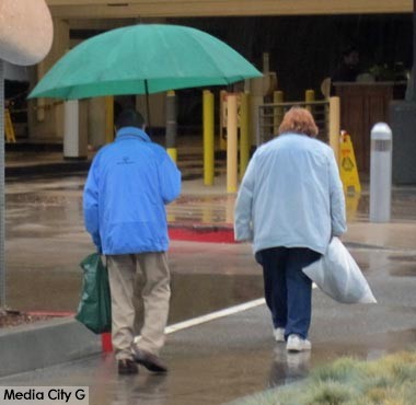 Photo: FLLewis / Media City G --  Two pedestrians in rain gear in Burbank December 2, 2014