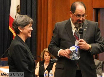Photo: Greg Reyna / Media City G -- Public works director Bonnie Teaford and outgoing mayor Dr. David Gordon share a light moment at the city council reorganization meeting at Burbank City Hall May 1, 2015