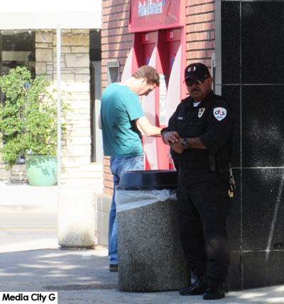 Photo: FLLewis / Media City G -- Security guard standing by the door at Bank of America 3400 West Magnolia Blvd Burbank August 18, 2017