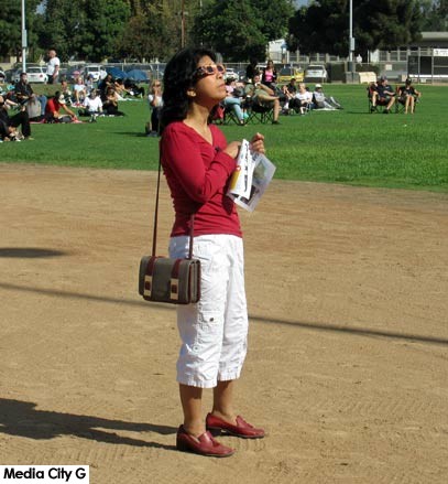 Photo: FLLewis / Media City G -- Woman looks to the sky for the solar eclipse at George Izay Park in Burbank August 21, 2017