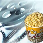 phto of movie reel and continer of popcorn