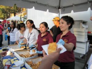 Photo: The Porto's Bakery crew handed out hundreds of treats to celebrants at the Party of the Century in Downtown Burbank July 8, 2011