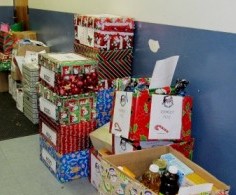 Photo: FLLewis/Media City G -- Hundreds of holiday baskets, boxes, and bags lined the walls outside the auditorium at George Washington Elementary school in Burbank December 16, 2011