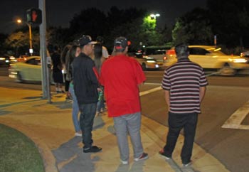 Photo: FLLewis/Media City G -- Flash mob fans wait to cross Burbank Boulevard in Burbank after parking their cars August 13, 2013