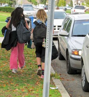Photo: FLLewis/Media City G -- Two students on North Screenland Drive head home from Luther Burbank Middle School Burbank winter 2011