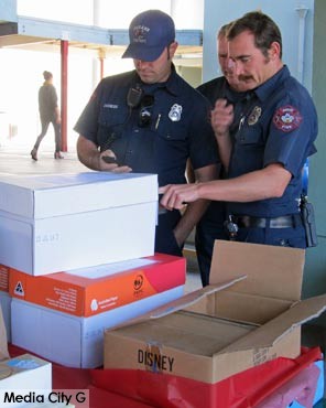 Photo:FLLewis / Media City G -- A group of Burbank firefighters checked the name and address of a holiday basket order at Washington Elementary December 13, 2014