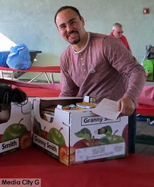 Photo: FLLewis / Media City G -- Burbank City Council candidate Juan Guillen at Washington Elementary where he collected holiday baskets for delivery on December 13, 2014