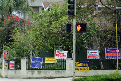 Photo:  FLLewis / Media City G -- Numerous political signs line a fence of a resident at Verdugo Avenue and Buena Vista Street in Burbank February 23, 2015