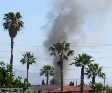 Photo: FLLewis / Media City G -- Smoke column from fire in 300 block of West Spazier in Burbank March 20, 2015