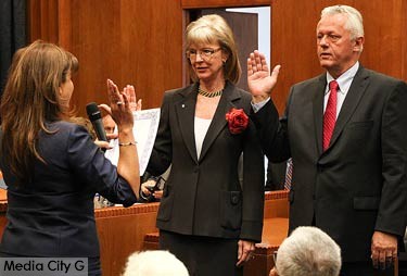 Photo: Greg Reyna, Media City G --  Re-elected council member Emily Gabel-Luddy and new council member Will Rogers took the oath of office from City Clerk Zizette Mullins at City Hall in Burbank May 1, 2015